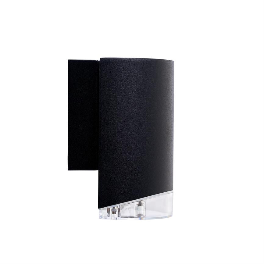 Black curved wall lamp mounted on the wall; lower edge has clear plastic where two light sources/LED components are visible; simple, modern shape photographed against a solid white background.