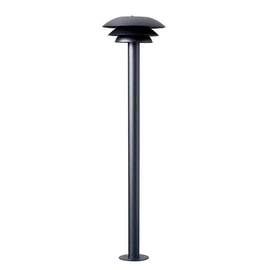 A slim, dark gray bollard lamp with three rounded shades at the top stands on a round base and is depicted isolated against a uniform white background.