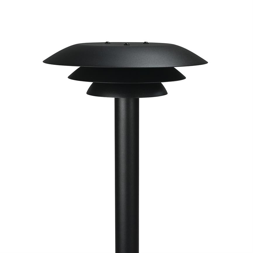 Black outdoor lamp mounted on a thin pole, with three overlapping bowl-shaped shades designed to direct the light downwards, photographed against a neutral white studio background.