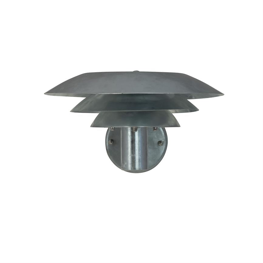 Metal wall lamp with three layered, flat shades mounted on a round wall bracket; the screens shield and distribute light downwards, placed in front of a neutral, white background.
