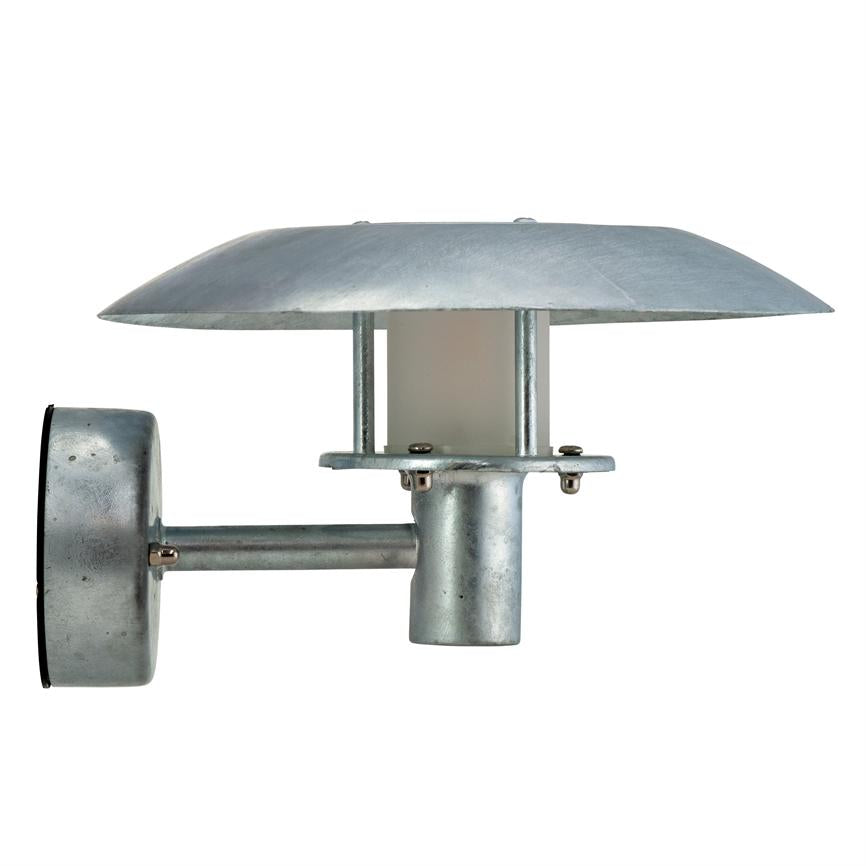Metallic wall lamp mounted on a short arm; round, flat screen covers light source; robust galvanized surface — presented against a uniform white background.
