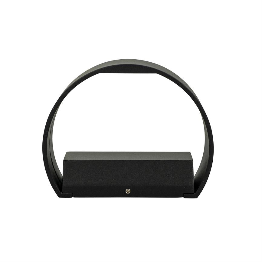 Black ring-shaped lamp encloses a low rectangular base; mounting screw is visible in front, placed on a uniform white background.