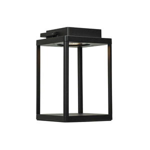 Black, cube-shaped metal fixture shines downward from an internal light source; open frame with four columns, isolated on a white studio background.