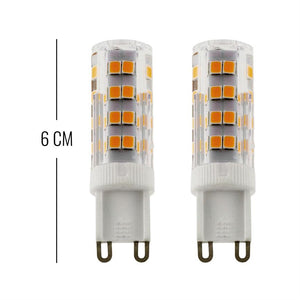 Two G9 LED bulbs with visible yellow LED chips, standing side by side in front of white background; next to a ruler with the text "6 CM".