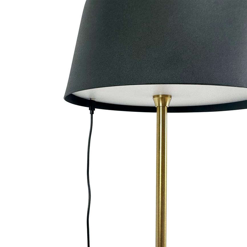 A gold-colored lamppost holds a black cylindrical lampshade; a black power cable hangs from the bottom of the screen against a clean, white background.