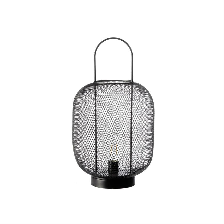 Black metal mesh lantern with curved handle, contains a visible light bulb in the center; stands on a round base against a pure white background.