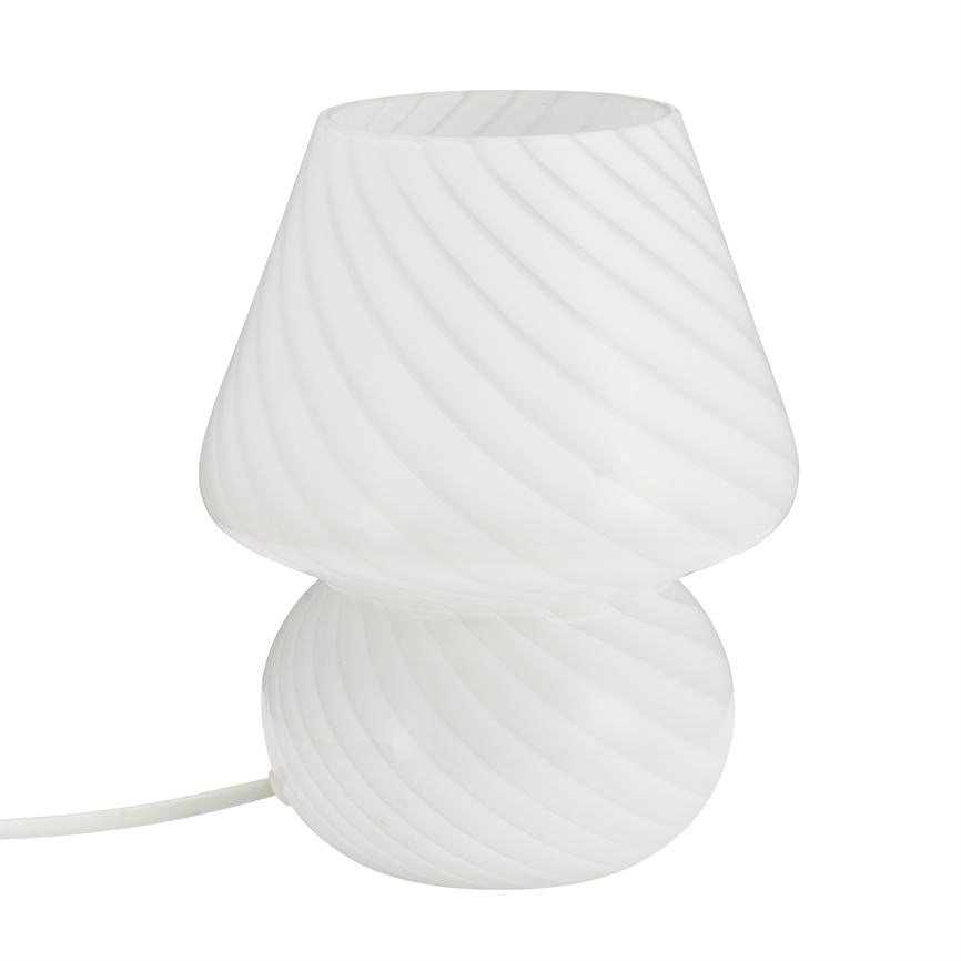 White table lamp with spiral grooves, consisting of two rounded sections, stands off on white background; white wire leads out to the left.