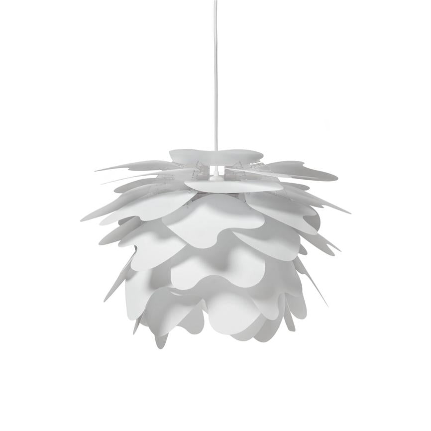 White pendant hanging by a thin wire; overlapping leaf-shaped plates form a round, flower-like shade that encloses the light source, presented against a neutral white background.