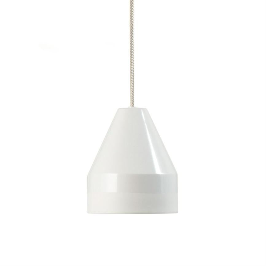 Hanging white pendant light hovers in the center; conical ceramic shade with smooth surface and shielded bottom, suspended in braided beige cord against plain white background.