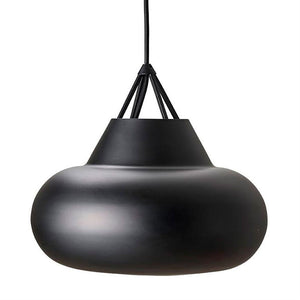 Black pendant lamp hangs in three visible fabric cords over white background; round, inflated dome-shaped screen with matte, slightly reflective surface; minimalist, modern interior design style.