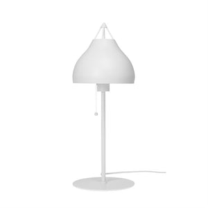 A white table lamp stands on a slender rod and round base; a curved screen with a hanging drawstring and clear upper metal construction is displayed against a uniform white background.