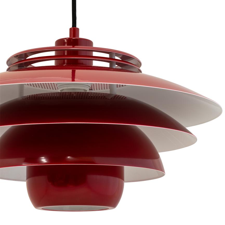A red, shiny tiered pendant light hangs from a black cord; multi-slice screens reflect light. Close-up against a neutral white background.