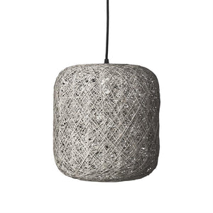 A cylindrical, woven lampshade hangs from a black cord, the light within hinted at through crossed linen or rattan threads; simple, natural pendant against a neutral, white background.