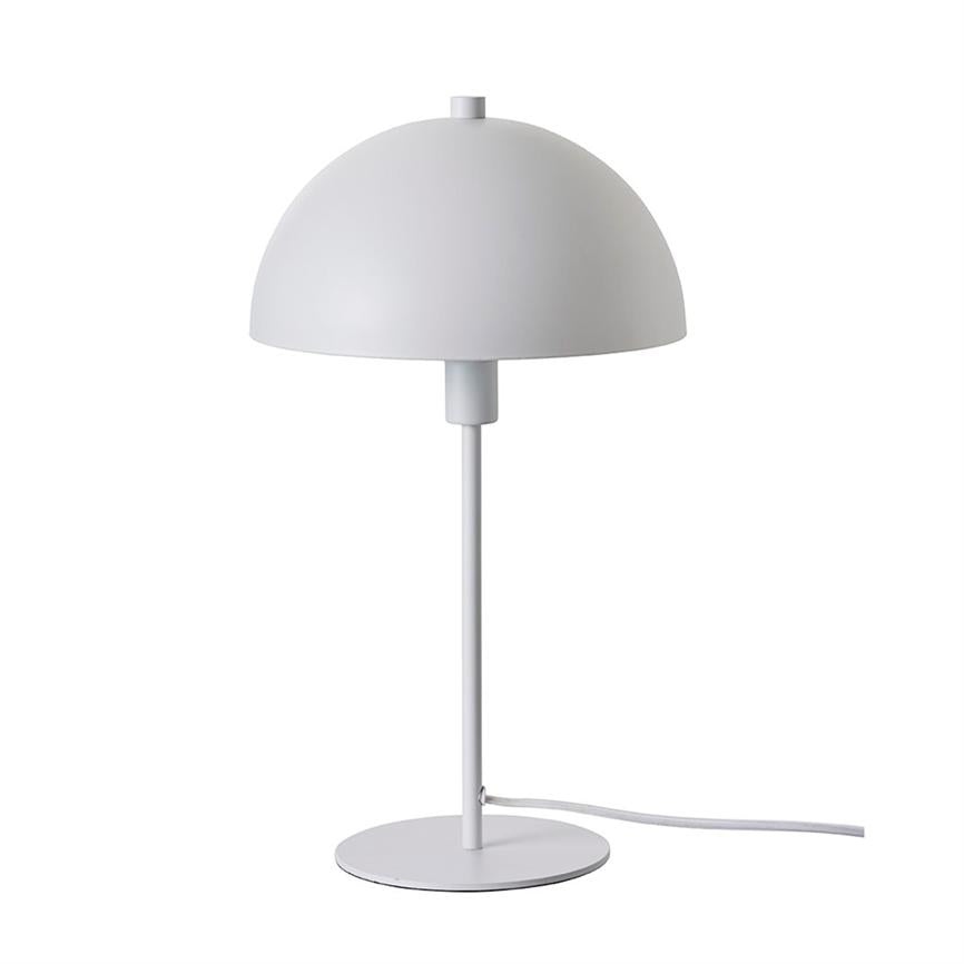 Table lamp with hemispherical shade stands on a slim rod mounted on a round foot; the screen covers the light source, white power cable runs out to the right on white background.