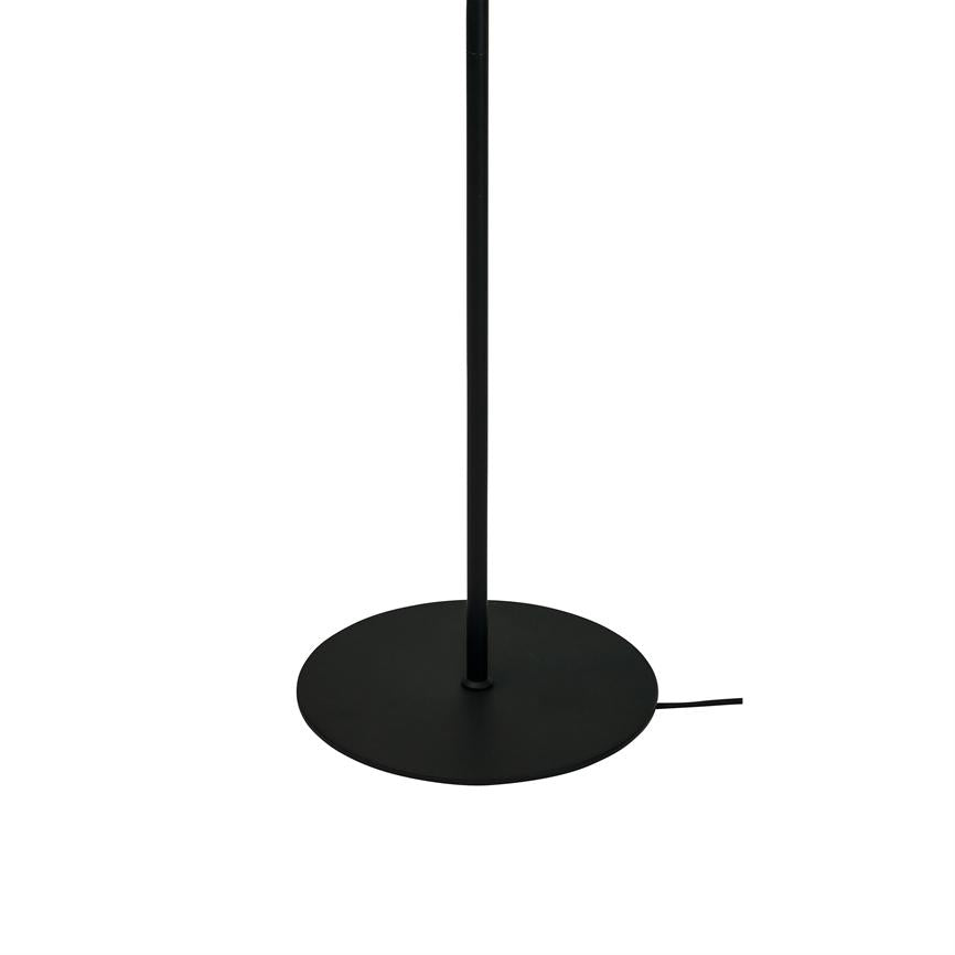 Black lamp stand stands vertically on a flat, round base; a thin power cable sticks out from the edge. Simple modern design on white studio background.