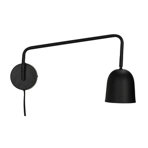 Black wall lamp with round wall mount, long outstretched arm holding a bell-shaped shade; a wire hangs down against a neutral white background.
