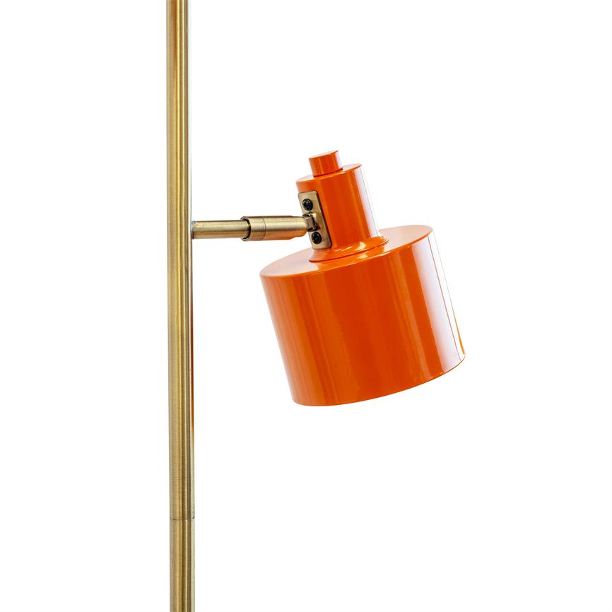 Orange lampshade is tilted and attached to a vertical brass rod via an adjustable brass link, against a uniform white background.