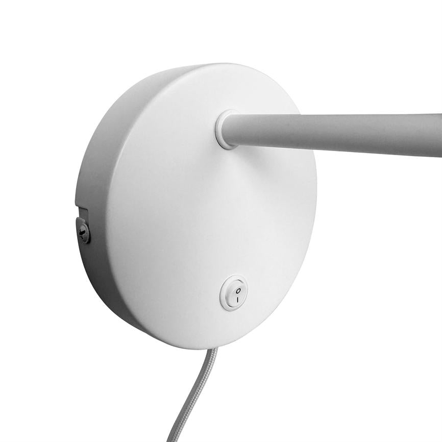 Round white wall plate, holding a horizontal metal rod out to the right, has a small on/off switch and a textile-wrapped power cable hanging, mounted against a uniform white background.
