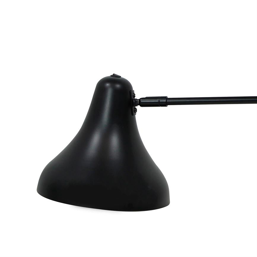Black metal lampshade mounted on an adjustable arm, angled downwards over a white blank background.