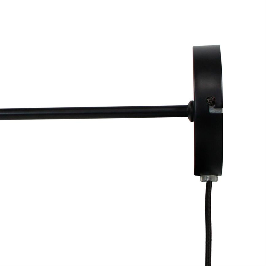 Black wall-mounted lamp base extends a thin, straight metal rod to the left, while a black textile cable hangs vertically down; white, uniform background.