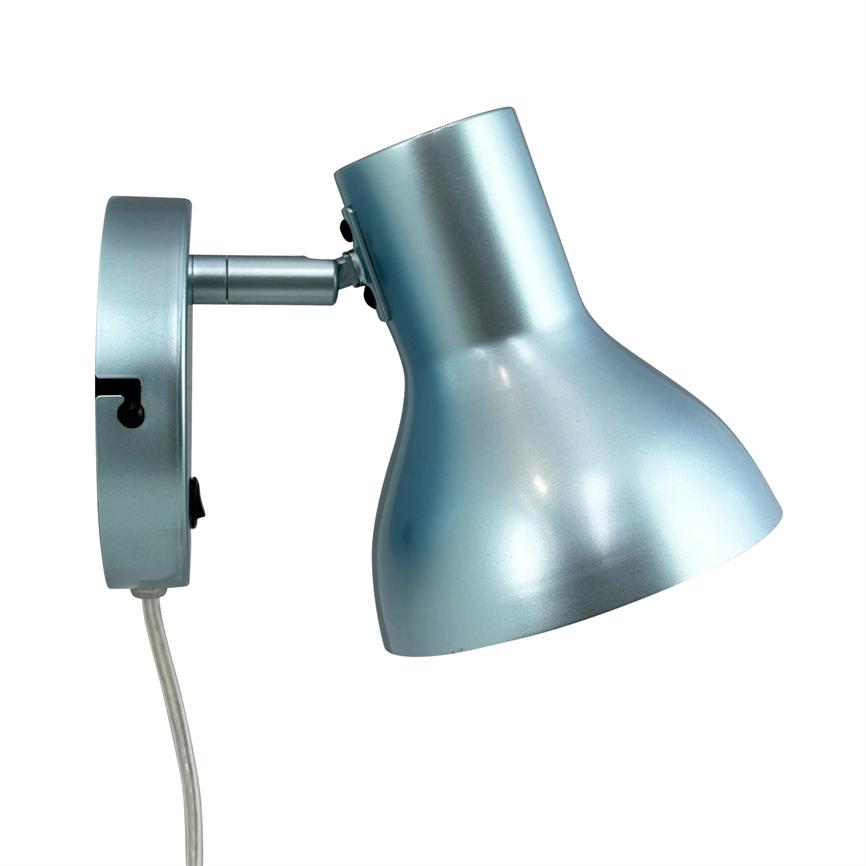 Metal wall lamp points downwards; screen is hinged to a round wall base with exposed wire, matte light blue metal finish against white background.