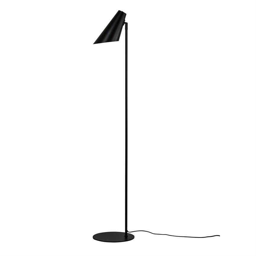 Black floor lamp stands upright, shade points obliquely downwards; slim metal rod on round foot with visible wire, placed against white background.