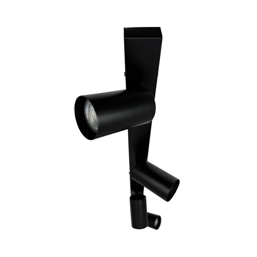 Black cylindrical spotlights mounted on a vertical rectangular plate; three adjustable lamps pointing in different directions on white background.