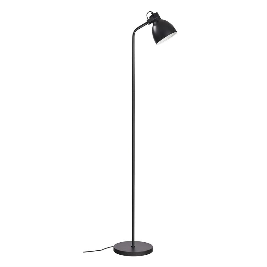 Black, slim floor lamp stands upright with a curved arm and downward-facing shade, placed on a round base against a uniform white background.