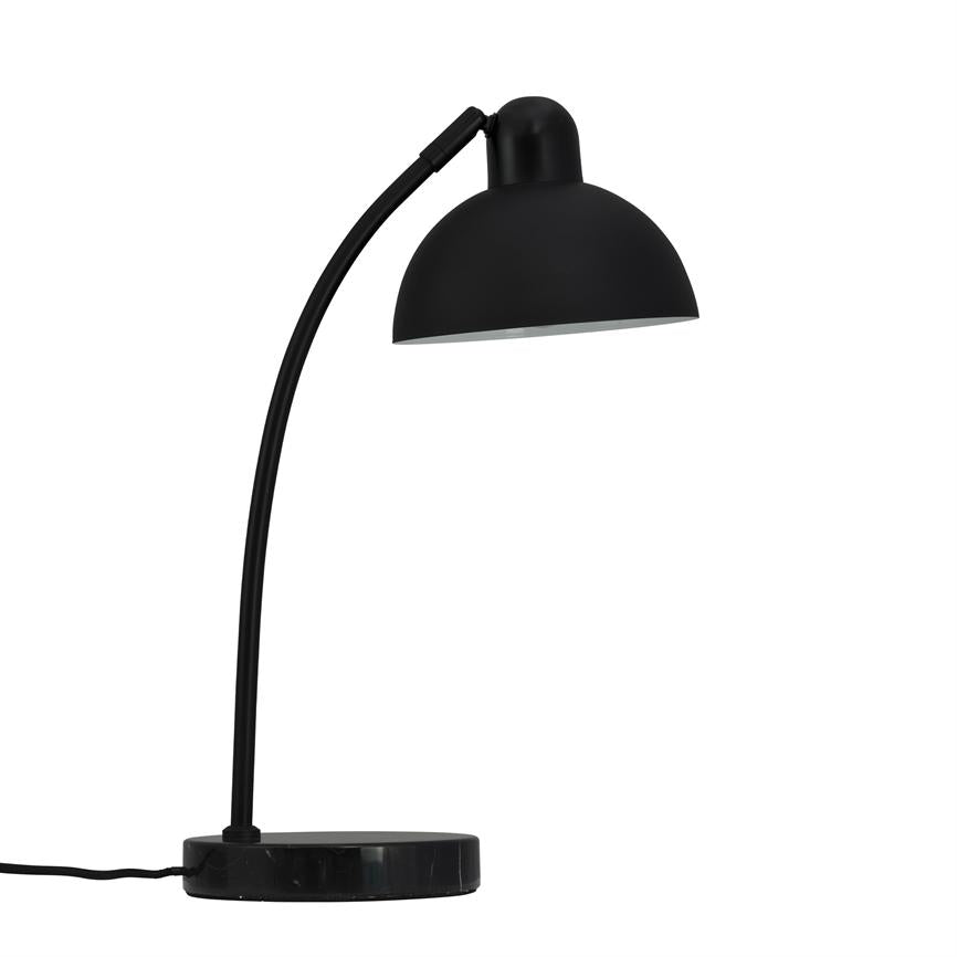 Curved arm desk lamp that angles a black hemispherical shade downwards; round heavy base on white background, with power cable extended to left.
