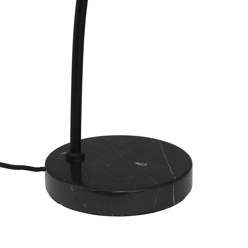 Black marble base supports a thin black lamp arm; a fabric-covered cord runs out to the side on a uniform white background.