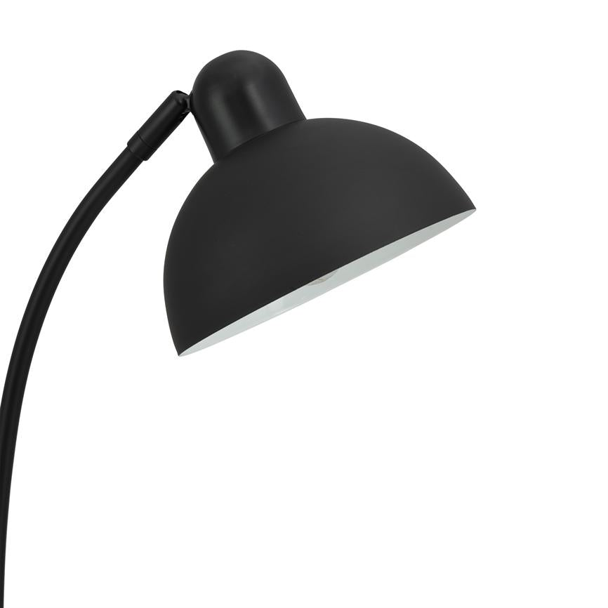 A black table lamp with a hemispherical shade, angled downwards; the arm is curved and attached at the top; simple, clean white background with no other objects.