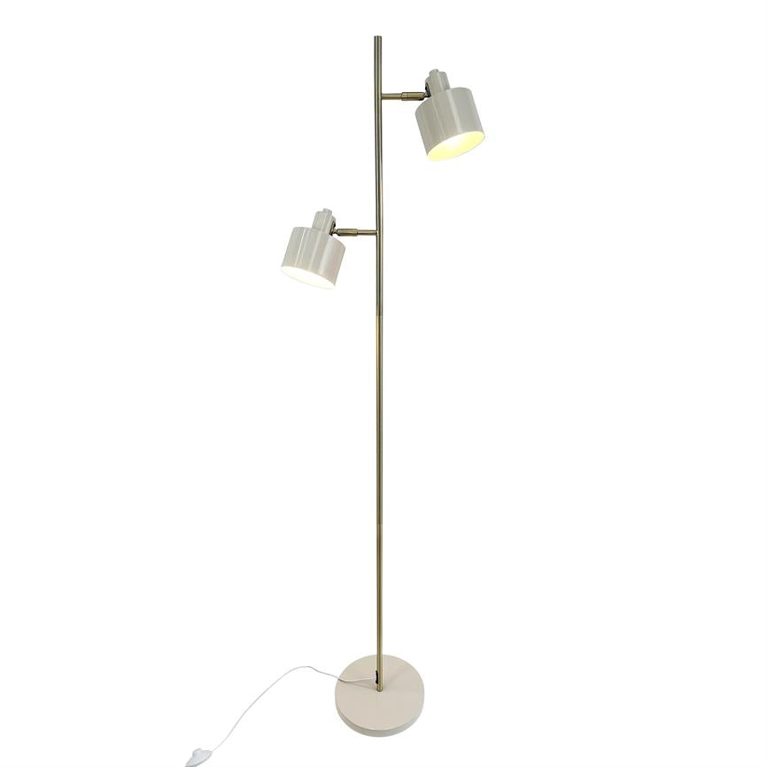 Floor lamp with two white, adjustable shades mounted on a slender brass rod; one tilts downwards, the other upwards. Stands on a round base with a visible white cord against a white background.