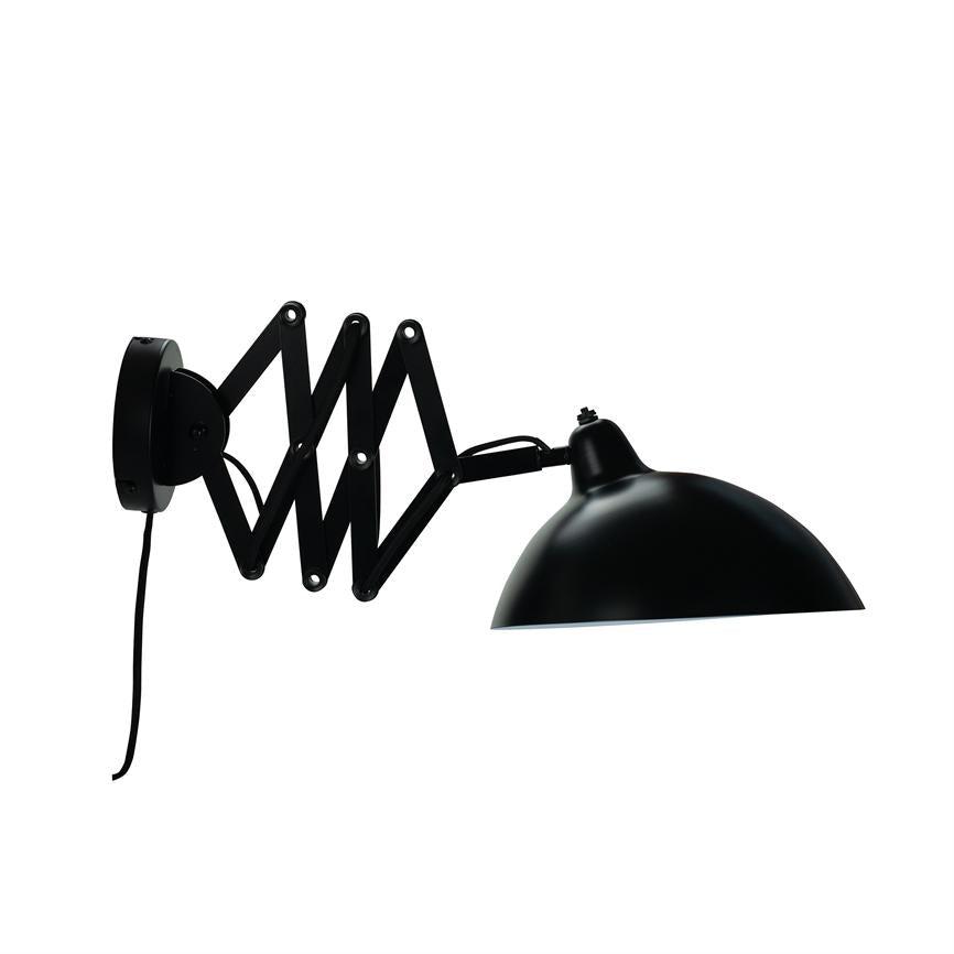 Scissor arm wall lamp unfolds and carries a black hemispherical shade; mounted on round wall bracket with black cord hanging down in front of white background.