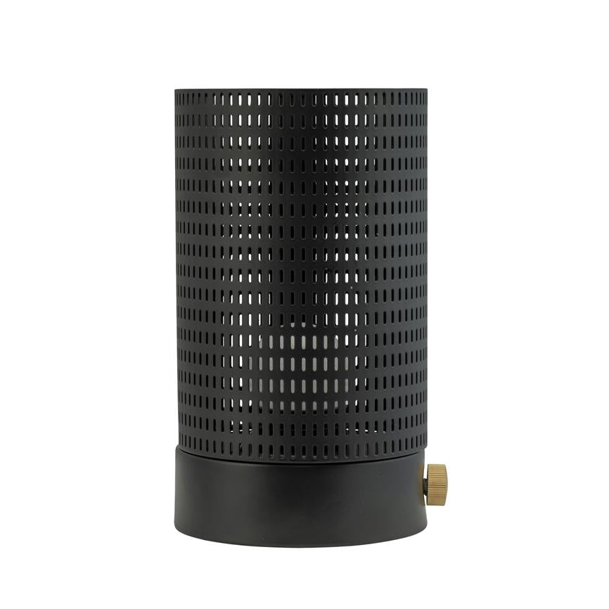 Black, perforated cylinder standing upright on a white background; metal casing with regular oblong holes and a small brass button at the bottom, appears as an electronic device.