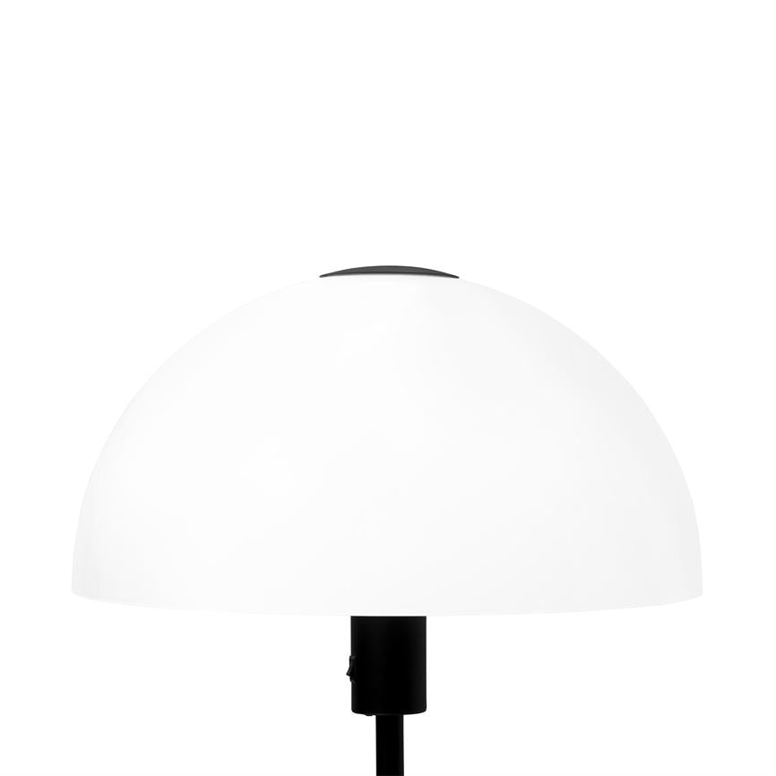 White dome lamp emits soft, diffused light from a black stand against a uniform white background.