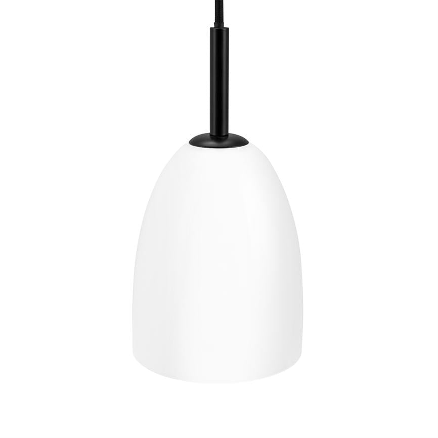 White pendant hanging from a black cord; smooth, dome-shaped lamp suspension stands in focus against a uniform, white background.