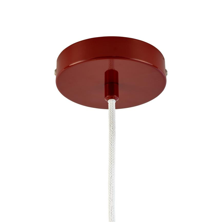 Round red ceiling rose holds a white braided cord hanging vertically from the center against a uniform white ceiling background.