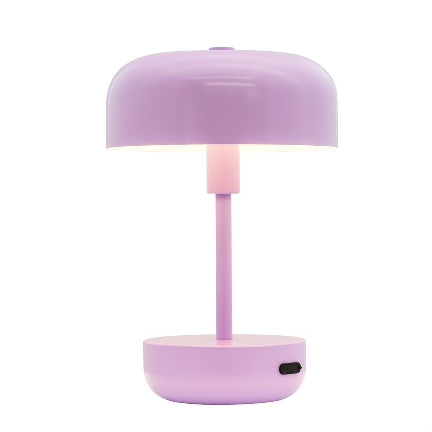 Table lamp — purple, bowl-shaped shade over slender pillar; it emits soft, warm light and stands on a round base with on/off button, set against a white background.