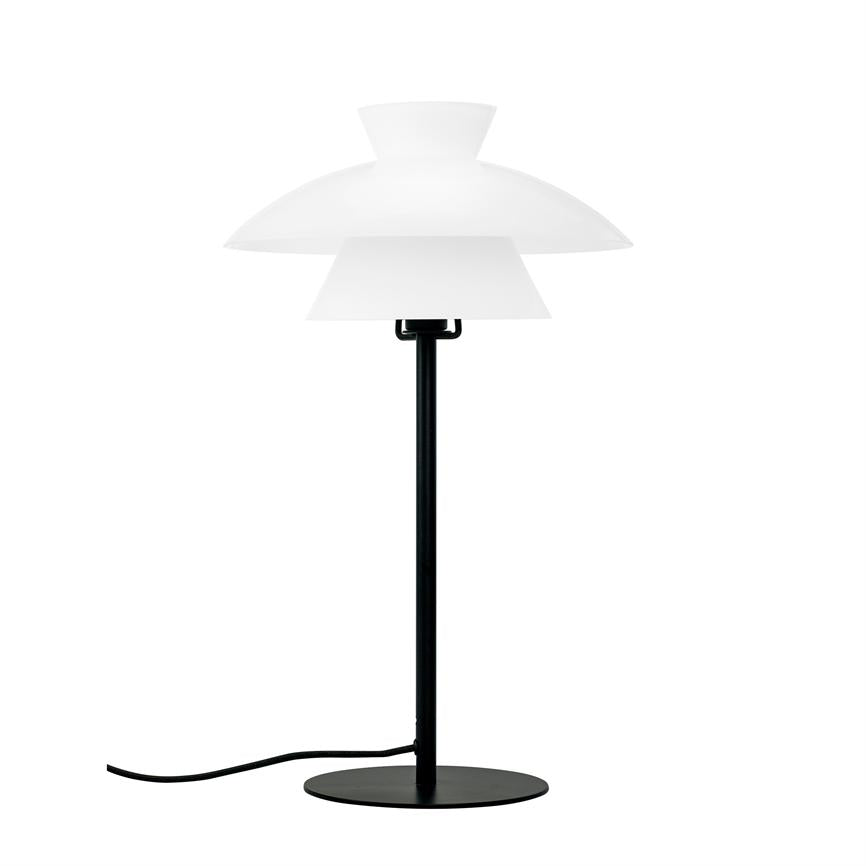 Table lamp stands upright: slim black rod on round black base, three white, tiered shades at top; black wire is bent to the side on a neutral white background.