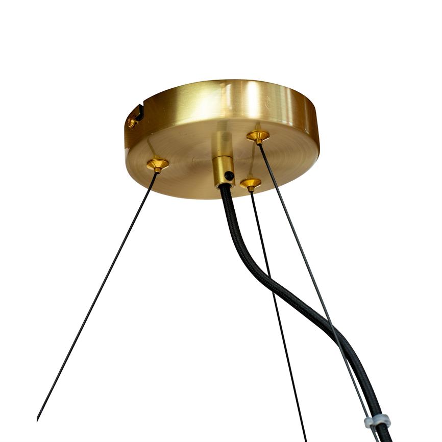 The brushed brass ceiling rose, mounted in the ceiling, holds three thin suspension wires and a twisted black power cord that hangs down against a neutral white background.
