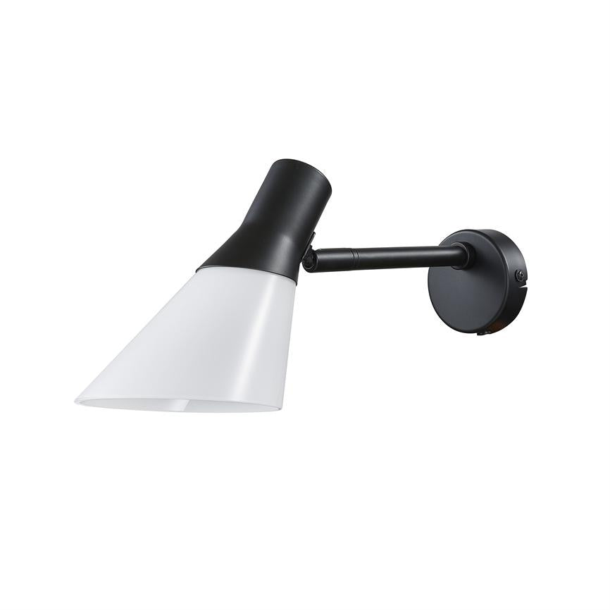 A black-and-white wall lamp points downwards in an adjustable black arm; conical white lampshade and round wall base against a clean white background.