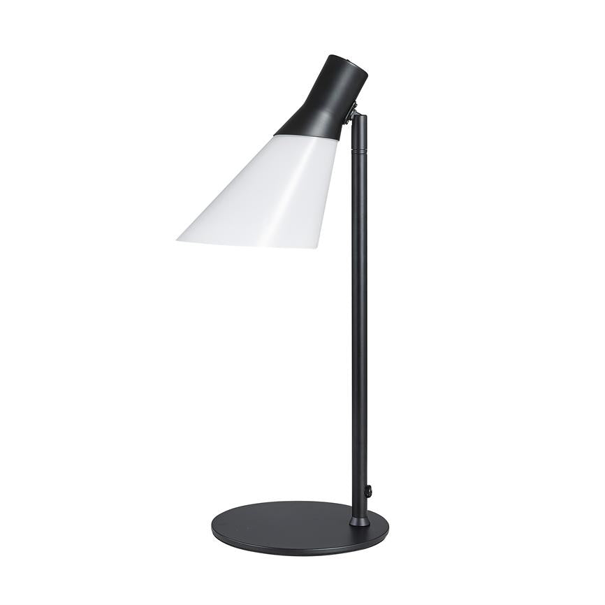 Table lamp with black metal rod and white, slanted shade, points downwards and stands on a round black base in front of a uniform white background.