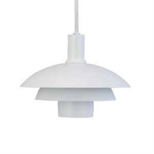 White pendantlamp with three layered shades hangs from a fabric-covered cord, placed in front of a uniform white background.