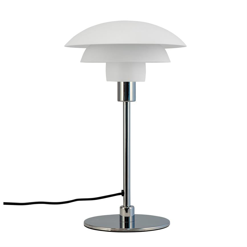 Table lamp stands on a round chrome base, has a slim chrome rod and a three-part white shade, with black cord against a uniform white background.