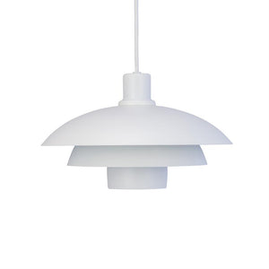 White, multi-layer pendant lamp hangs in a visible white fabric cord, without a lighted bulb, against a uniform white background — minimalistic and symmetrical.