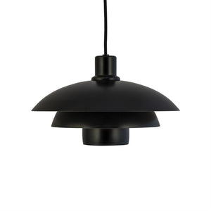 Black pendant lamp hangs from a single black cable; three layered, bowl-shaped shades form a round, matte silhouette against a uniform white background.