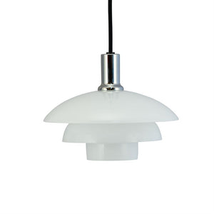 A white, layered pendant light hangs from a black cord; chrome socket and three opal glass shades in modern design, isolated on white background.