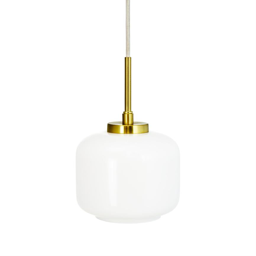 White glass pendant hangs from a fabric-covered cord with brass suspension; simple, matte white dome and golden bracket, isolated against a neutral white background.