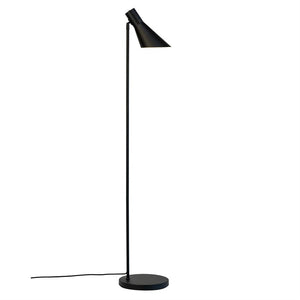 Black floor lamp stands and casts light downwards with an angled, conical shade; slim rod, round base and visible cord on white background.
