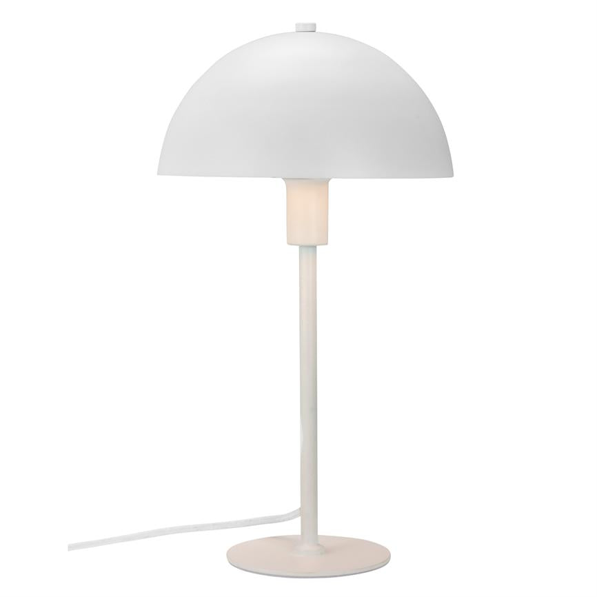 A white table lamp with a hemispherical shade that emits soft, warm light; stands on a slender stand with a round foot, cord visible against a neutral white background.